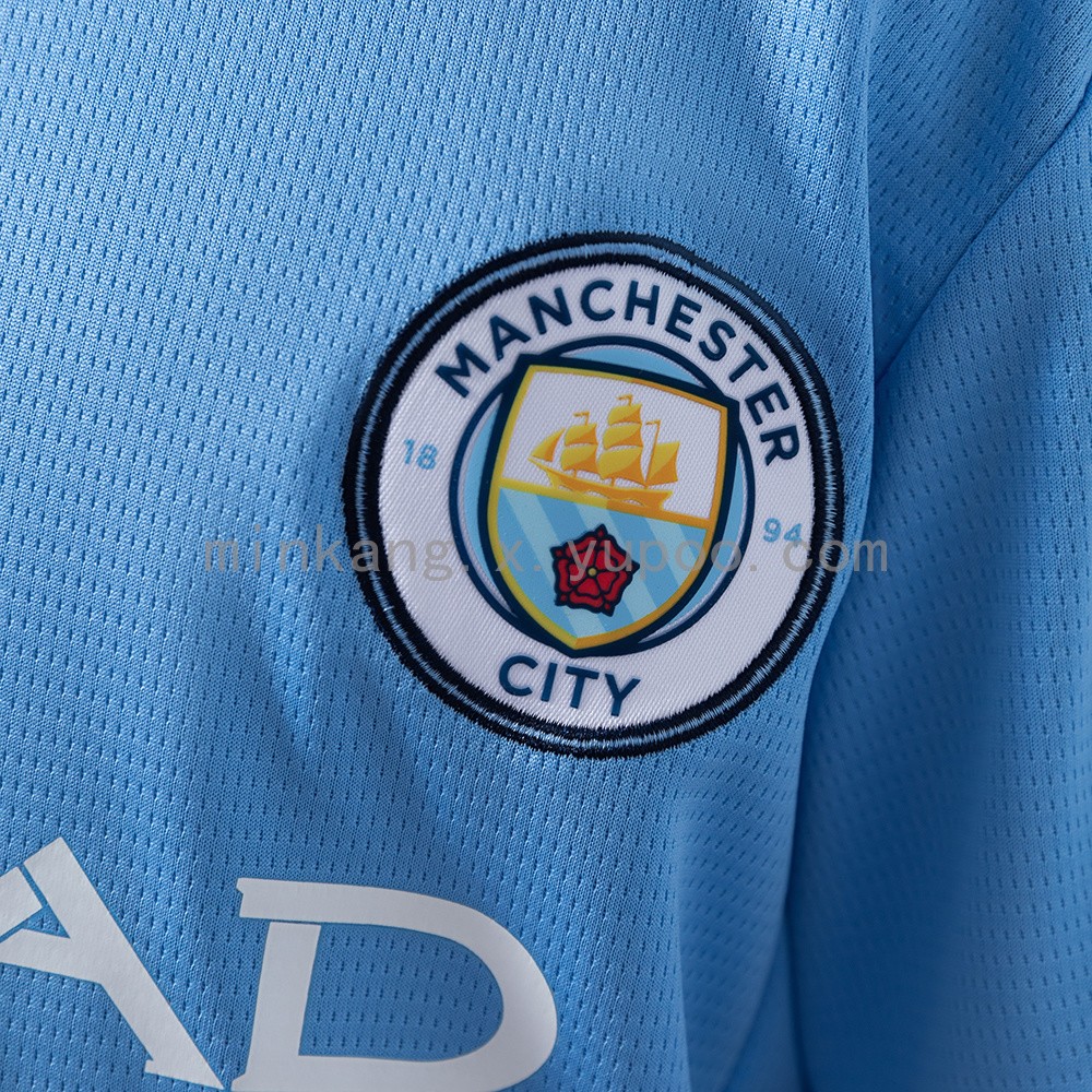 Manchester City jersey crest close-up home