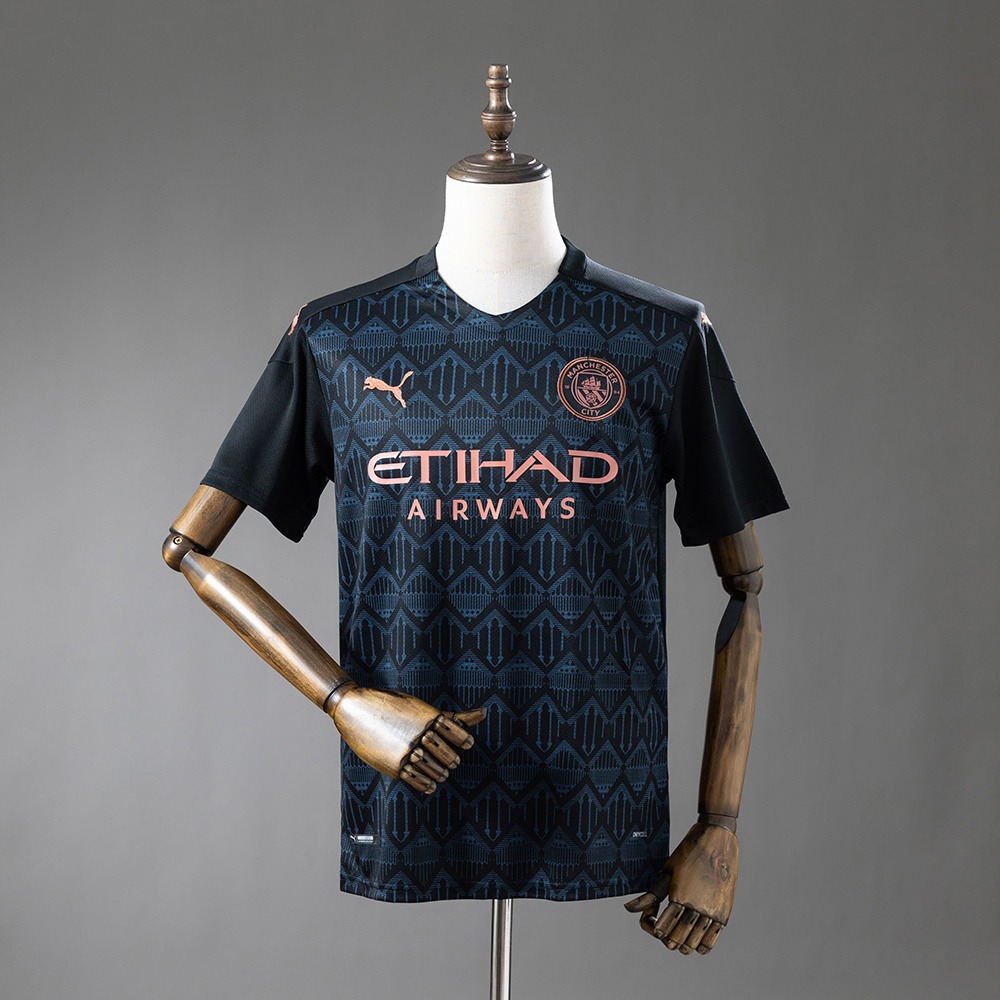 Svart Manchester City 20/21 retro bortedrakt med bronsefargede