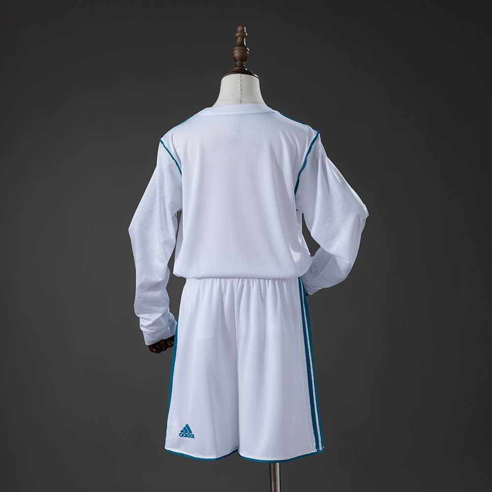 Hvit Real Madrid retrodrakt for barn 2017/18 med turkise detaljer og shorts