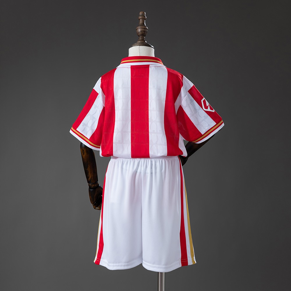 Sporting Gijón 2026/27 draktsett for barn med stripet trøye og hvite shorts sett bakfra