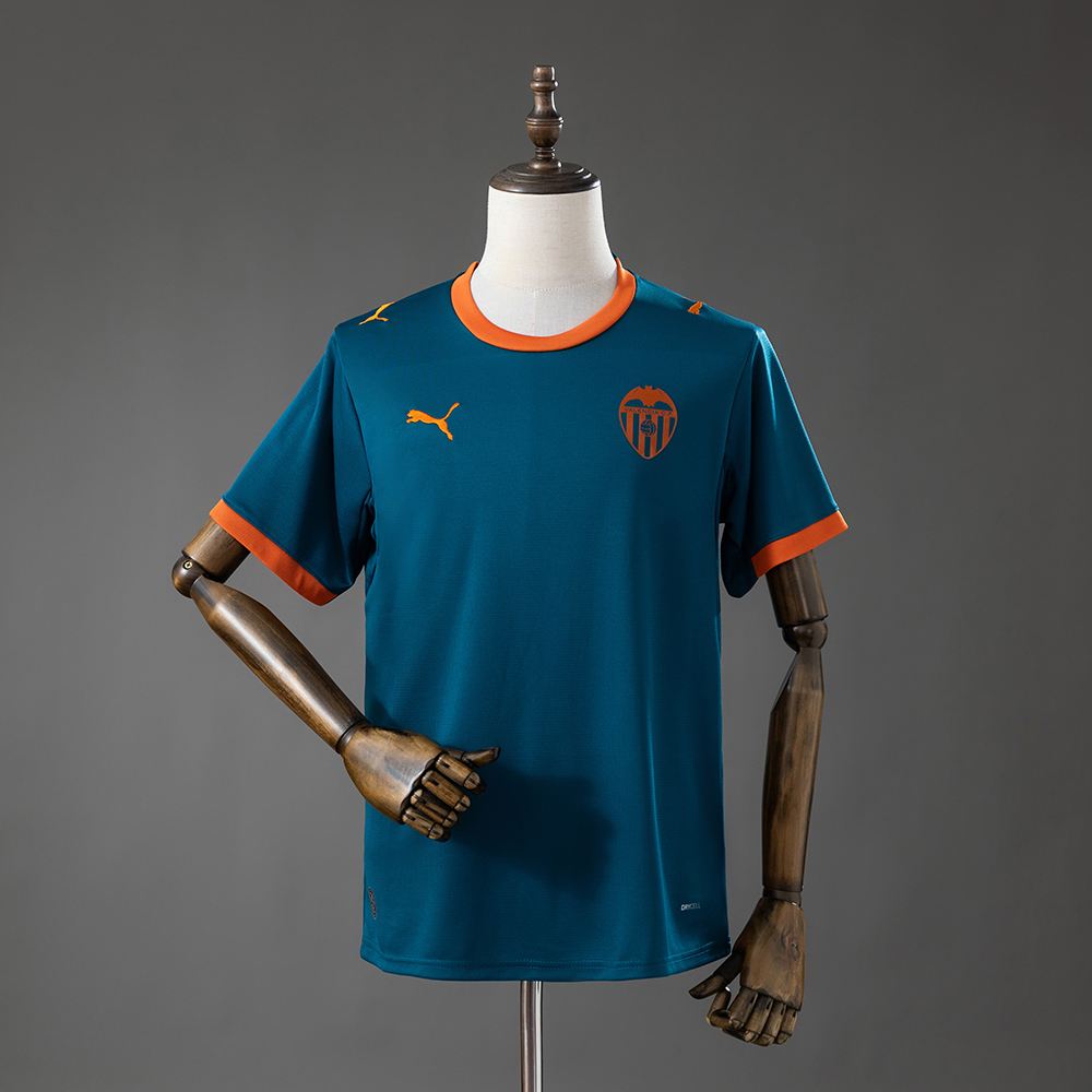 Valencia 2026/27 mørk blågrønn bortedrakt med oransje detaljer sett forfra